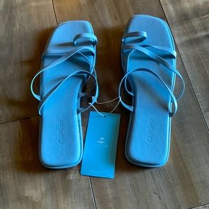 Blue laced flip flops